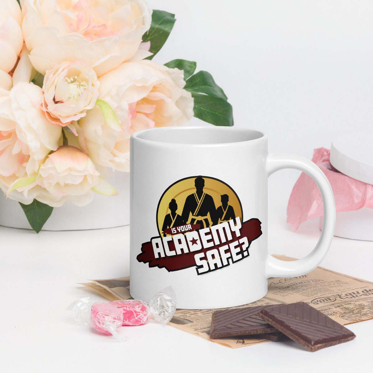 Academy Safe white glossy mug with logo on both sides, lifestyle view